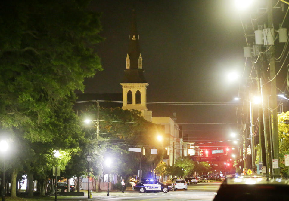 The steeple of Emanuel AME Church is visible as police close off a section of Calhoun Street (AP Photo/David Goldman)