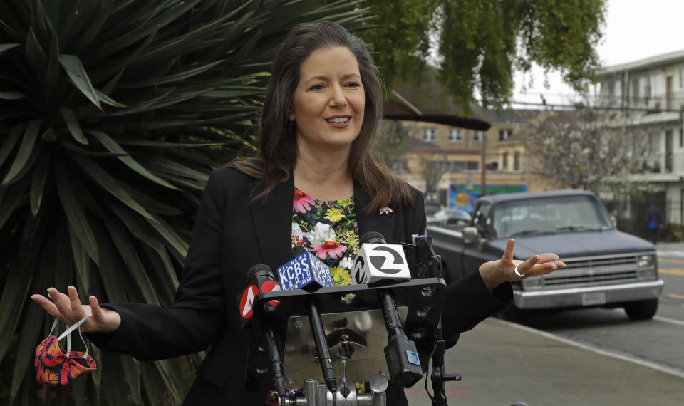 Oakland Mayor Libby Schaaf gestures while speaking at a media conference on Friday, April 10, 2020, in Oakland, Calif. Schaaf announced an initiative designed to make it safer to exercise and move about in Oakland by designating 74 miles of neighborhood streets for through traffic by bikes, pedestrians, wheelchair users, and local vehicles only, starting Saturday, April 11. (AP Photo/Ben Margot)