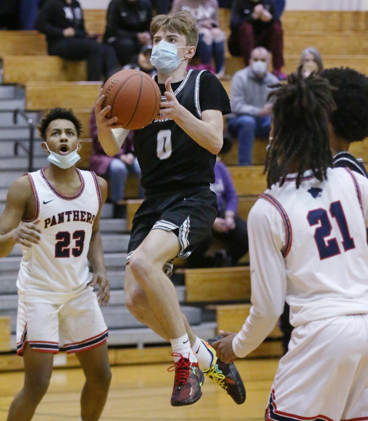 SOTA's Sam Howland (0), center, drives to the basket for two points during their Section V Class A2 first round playoff game at School No. 33 in Rochester Wednesday, Feb. 23, 2022. 