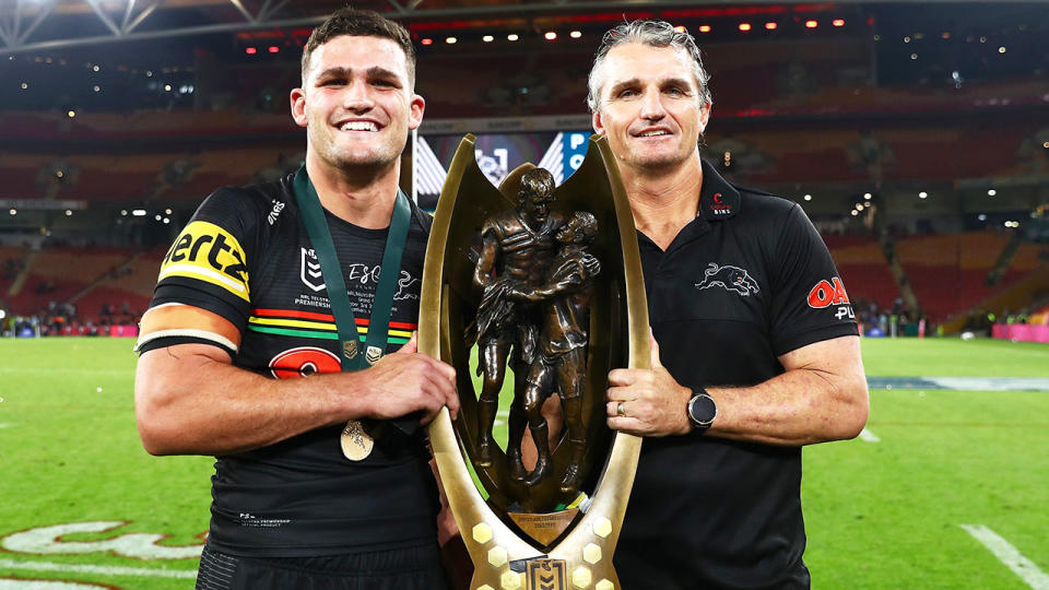 Penrith's Nathan and Ivan Cleary are seen here holding the NRL premiership trophy.