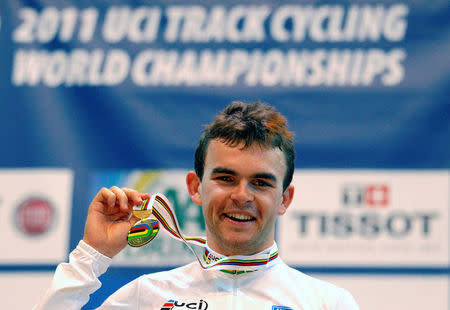 FILE PHOTO - Jack Bobridge from Australia celebrates winning the men's Individual Pursuit at the UCI Track Cycling World Championships in Apeldoorn March 24, 2011. REUTERS/Jerry Lampen/File photo