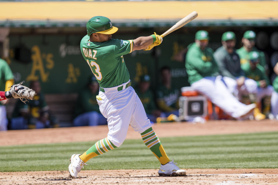 Oakland Athletics' Estuary Ruiz hits an RBI single against the Cincinnati Reds during the second inning of a baseball game in Oakland, Calif., Saturday, April 29, 2023. (AP Photo/John Hefti)