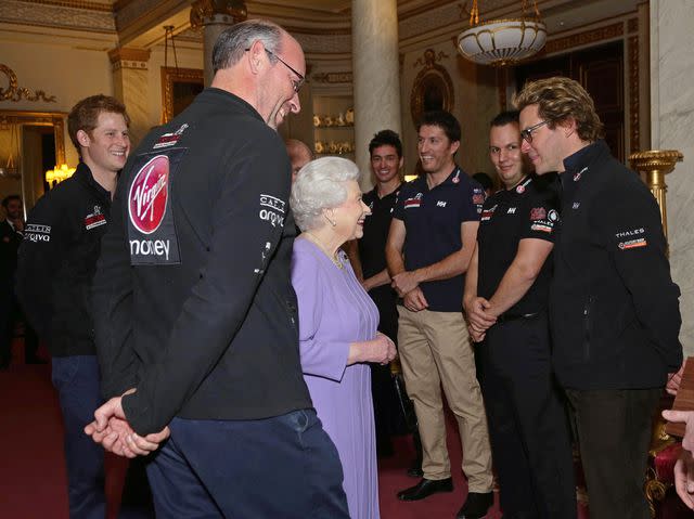 <p>Yui Mok - WPA Pool/Getty</p> Prince Harry, Queen Elizabeth and Dominic West in 2013