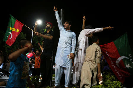 Supporters of Imran Khan, chairman of the Pakistan Tehreek-e-Insaf (PTI), political party celebrate during the general election in Islamabad, Pakistan, July 26, 2018. REUTERS/Athit Perawongmetha
