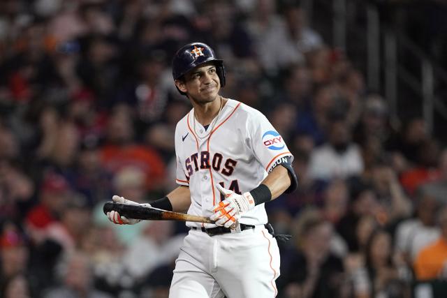 Houston Astros' Jeremy Pena, left, laughs with Mauricio Dubon