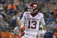 Arkansas quarterback Feleipe Franks (13) celebrates after throwing for a 47-yard touchdown to wide receiver Mike Woods during the first half of an NCAA college football game against Florida, Saturday, Nov. 14, 2020, in Gainesville, Fla. (AP Photo/Phelan M. Ebenhack)