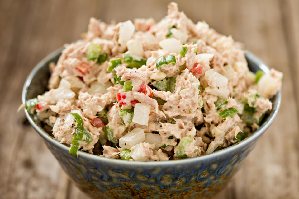 A blue ceramic bowl full of freshly made tuna salad