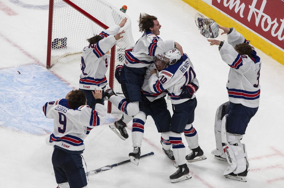 U.S. players celebrate a win over Canada in the championship game in the IIHF World Junior Hockey Championship, Tuesday, Jan. 5, 2021, in Edmonton, Alberta. (Jason Franson/The Canadian Press via AP)