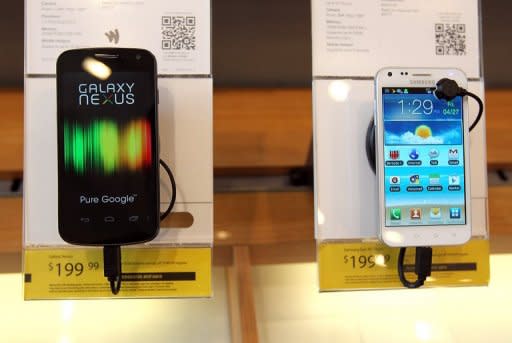 A Samsung Galaxy Nexus phones (L) is seen on display at a Sprint store, on April 27, in San Francisco, California. A judge on Friday granted Apple's request for an injunction blocking US sales of Samsung Galaxy Nexus, made in collaboration with Google to challenge the iPhone