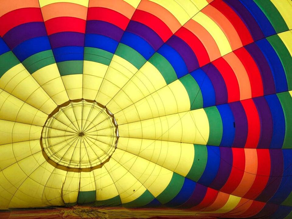 A hot air balloon inflates in Albuquerque, N.M., on Tuesday, Oct. 1, 2019. The annual Albuquerque International Balloon Fiesta is expected to draw several hundred thousand spectators and hundreds of balloonists from around the world. It will kick off Oct. 5 with a mass ascension.