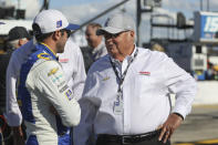 Driver Chase Elliott, left, talks to car owner Rick Hendrick before a NASCAR Cup Series auto race at Charlotte Motor Speedway in Concord, N.C., Sunday, May 30, 2021. (AP Photo/Nell Redmond)