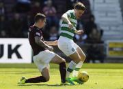 Britain Football Soccer - Heart of Midlothian v Celtic - Scottish Premiership - Tynecastle - 2/4/17 Celtic's James Forrest in action with Hearts' Jamie Walker Reuters / Russell Cheyne Livepic