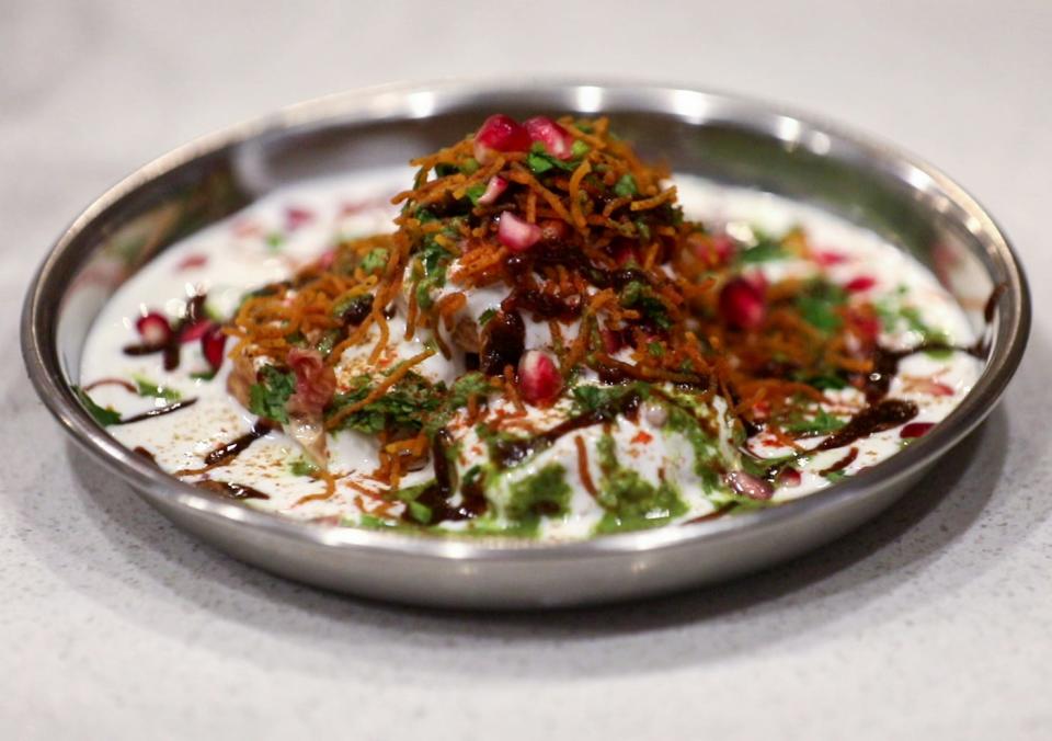 On the snacks menu at Ela Curry Kitchen in Palm Beach Gardens: dahi bhalle, which combines lentil fritters, yogurt, tamarind chutney, cilantro and crispy sev.