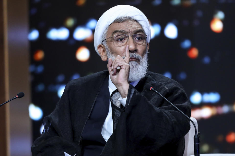 In this picture made available by Iranian state-run TV, IRIB, presidential candidate for June 28, election, Mostafa Pourmohammadi speaks in a debate of the candidates at the TV studio in Tehran, Iran, Monday, June 17, 2024. (Morteza Fakhri Nezhad/IRIB via AP)