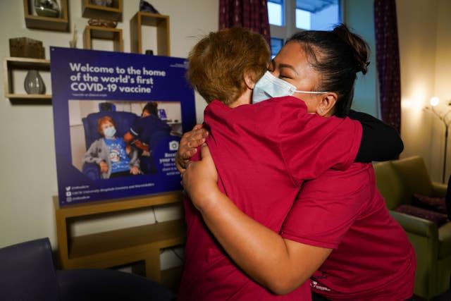 Margaret Keenan embraces the nurse who gave her the first jab, May Parsons