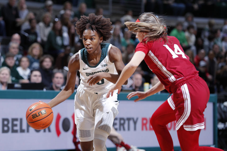 Michigan State's Kamaria McDaniel, left, drives against Indiana's Sara Scalia (14) during the first half of an NCAA college basketball game Thursday, Dec. 29, 2022, in East Lansing, Mich. Michigan State won 83-78. (AP Photo/Al Goldis)