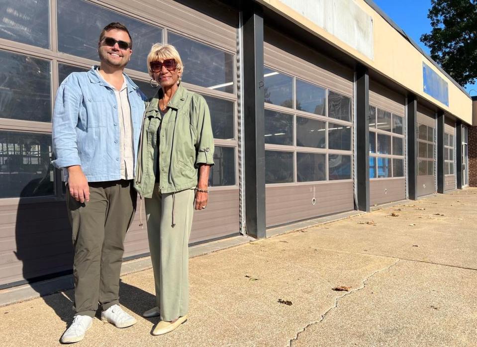 Betty Smith, executive director of EN-RICH-MENT Fine Arts Academy in Canton, and Mike Scott, CEO of the Bluecoats in Stark County, are shown outside the former Ziegler Tire building in downtown Canton, the proposed site of a permanent home for EN-RICH-MENT.