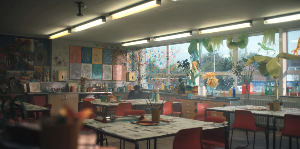 Art room covered in projects and with jungle windows