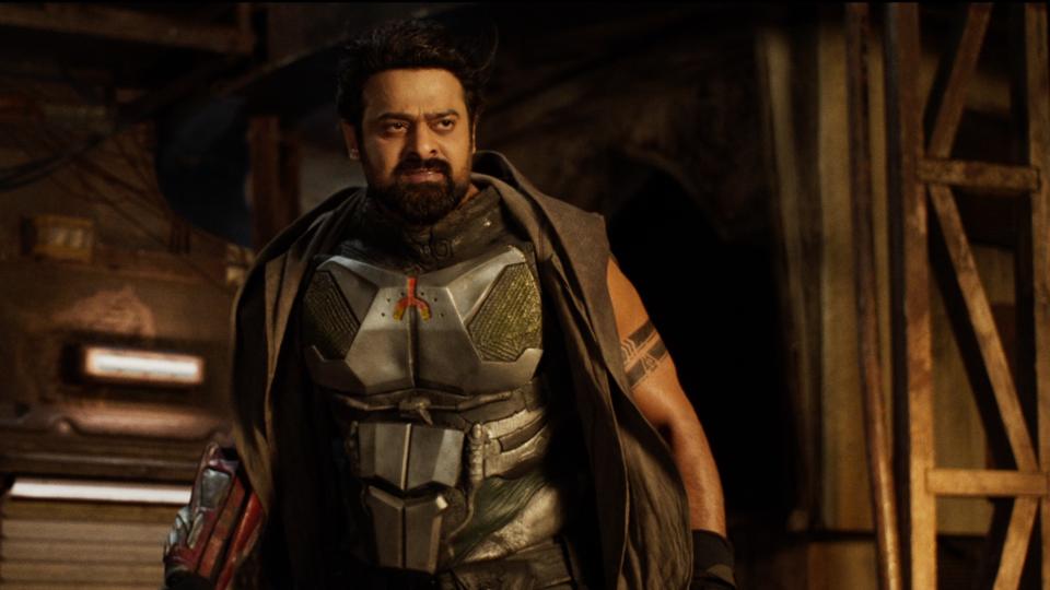 A bearded man wearing futuristic metal battle armor; Prabhas in 'Kalki 2898 AD'