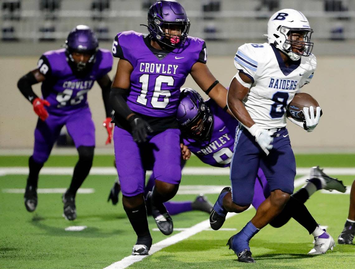 L.D. Bell running back Gracien Anto (8) attempts to get out of the backfield chased by Crowley defensive lineman Johnnie Wilson (16) in the first half of a high school football game at Crowley ISD Multipurpose Stadium in Crowley Texas, Friday, Sept. 23, 2022. L.D. Bell led Crowley 14-10 at the half. (Special to the Star-Telegram Bob Booth)