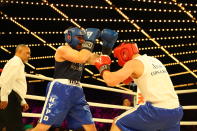 <p>Abe Niedzwoecki (blue) defends against Al Schneider (red) in the Brooklyn Queens Fisticuffs in the NYPD Boxing Championships at the Hulu Theater at Madison Square Garden on March 15, 2018. (Gordon Donovan/Yahoo News) </p>