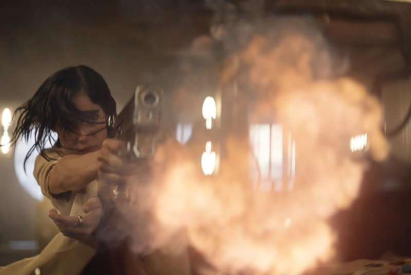 Kora (Sofia Boutella) shoots in slow motion. Photo courtesy of Netflix