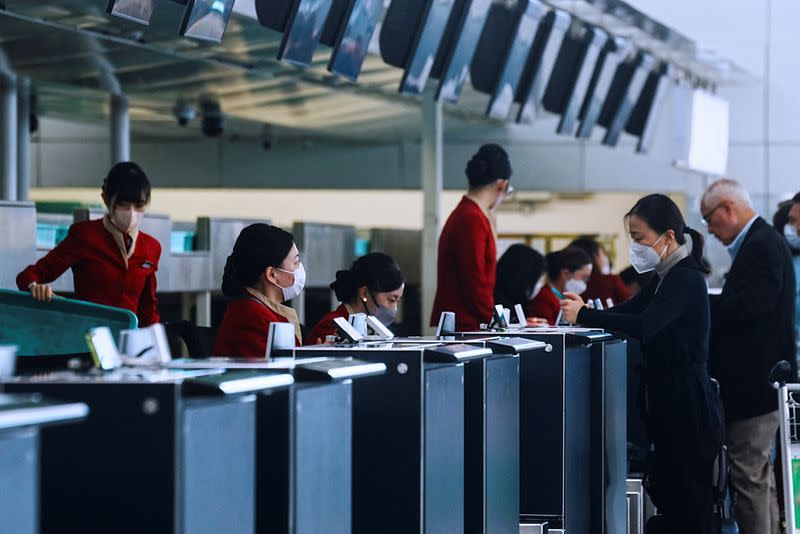 Cathay Pacific employees work at Hong Kong International Airport, in Hong Kong, China