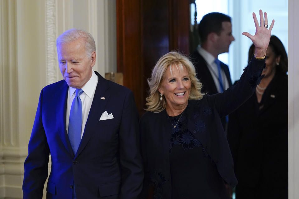 First lady Jill Biden waves as she arrives with President Joe Biden for a reception to celebrate the Jewish new year in the East Room of the White House in Washington, Friday, Sept. 30, 2022. (AP Photo/Susan Walsh)