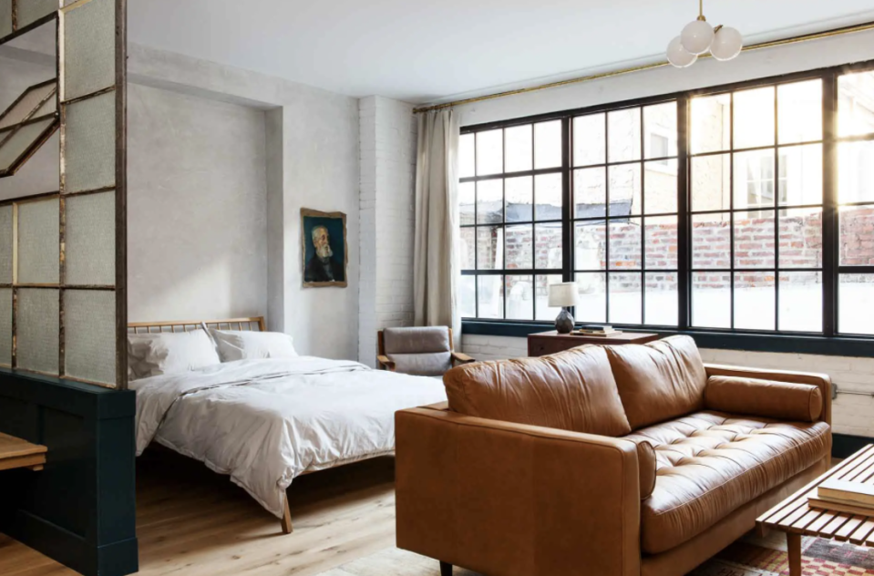 hotel suite with brown leather sofa