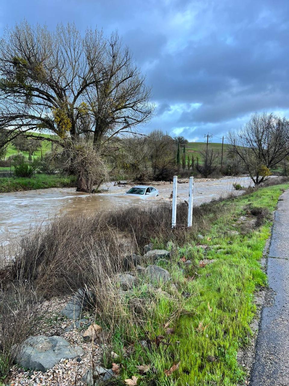 Two people were rescued from a vehicle stuck in the water near the 1100 block of San Marcos Road in Paso Robles on Feb. 19, 2024.