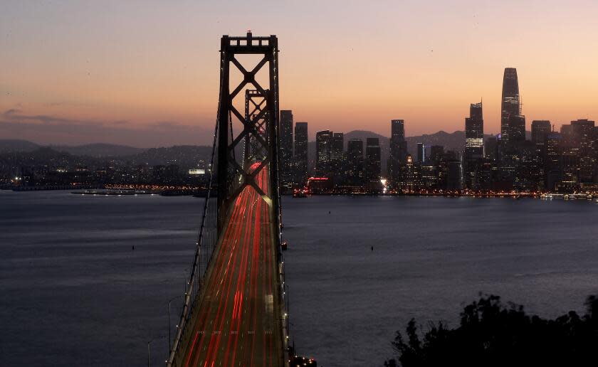 SAN FRANCISCO CA - OCT. 23, 2020. Traffic streams into San Francisco on the Oakland Bay Bridge on Friday, Aug. 23, 2020. San Francisco has done an excellent job following public health guidance and made a huge leap from the coronavirus orange tier to the less restrictive yellow tier, providing a pathway for more businesses and activities to reopen. (Luis Sinco / Los Angeles Times)