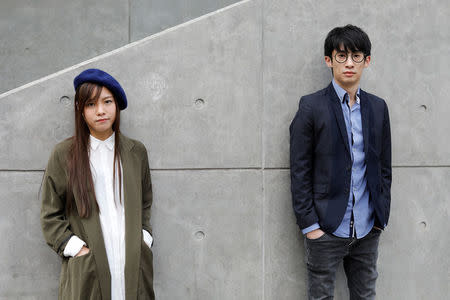 Disqualified lawmakers Yau Wai-ching, 25, (L) and Baggio Leung, 30, pose outside government headquarters in Hong Kong, China March 28, 2017. REUTERS/Tyrone Siu