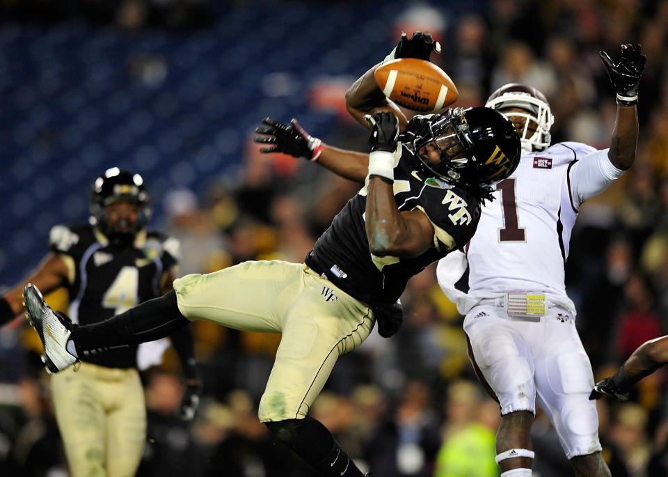 NASHVILLE, TN - DECEMBER 30: Duran Lowe #34 of the Wake Forest Demon Deacons intercepts a pass in the end zone intended for Chad Bumphis #1 of the Mississippi State Bulldogs during play at the Franklin American Mortgage Music City Bowl at LP Field on December 30, 2011 in Nashville, Tennessee. (Photo by Grant Halverson/Getty Images)