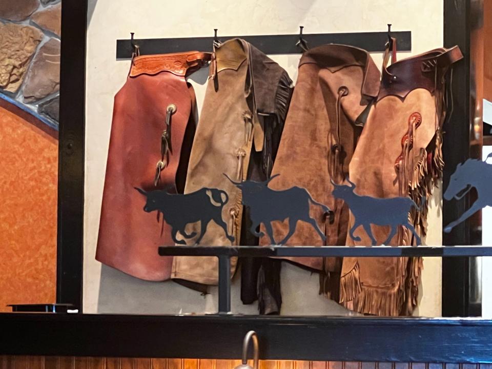 Cowboy chaps decorating the wall of a Longhorn Steakhouse