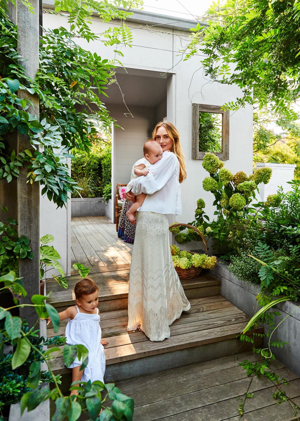 Grace Fuller Marroquin, with daughters Gloria and Flora, at their West Village town house. More than 50 plant varieties fill the beds, with an emphasis on New York species.