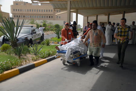 A victim of a suicide bomb attack at Imam al-Sadeq Mosque arrives at the Amiri hospital in Al Sharq, Kuwait City, June 26, 2015. REUTERS/Stringer