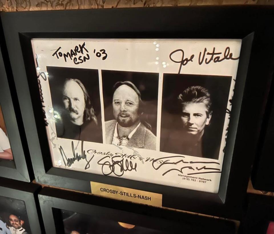 The autographed photos of rock bands, actors, athletes and other stars adorn the walls in the lobby of the Desert Inn restaurant in Canton.