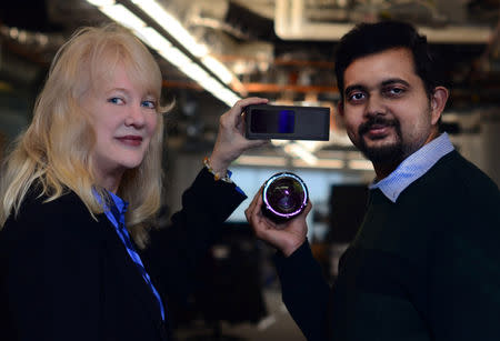 Velodyne Lidar Inc. President Marta Hall and Chief Technology Officer Anand Gopalan (R) hold the lidar maker’s solid state lidar Velarray and 180-degree hemispheric VelaDome lidar respectively in Alameda, California, U.S., in this recent photo released on February 20, 2019. Courtesy Velodyne/Handout via REUTERS