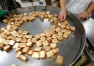 A worker prepares glace fruits for export at the Cruzilles factory in Clermont-Ferrand