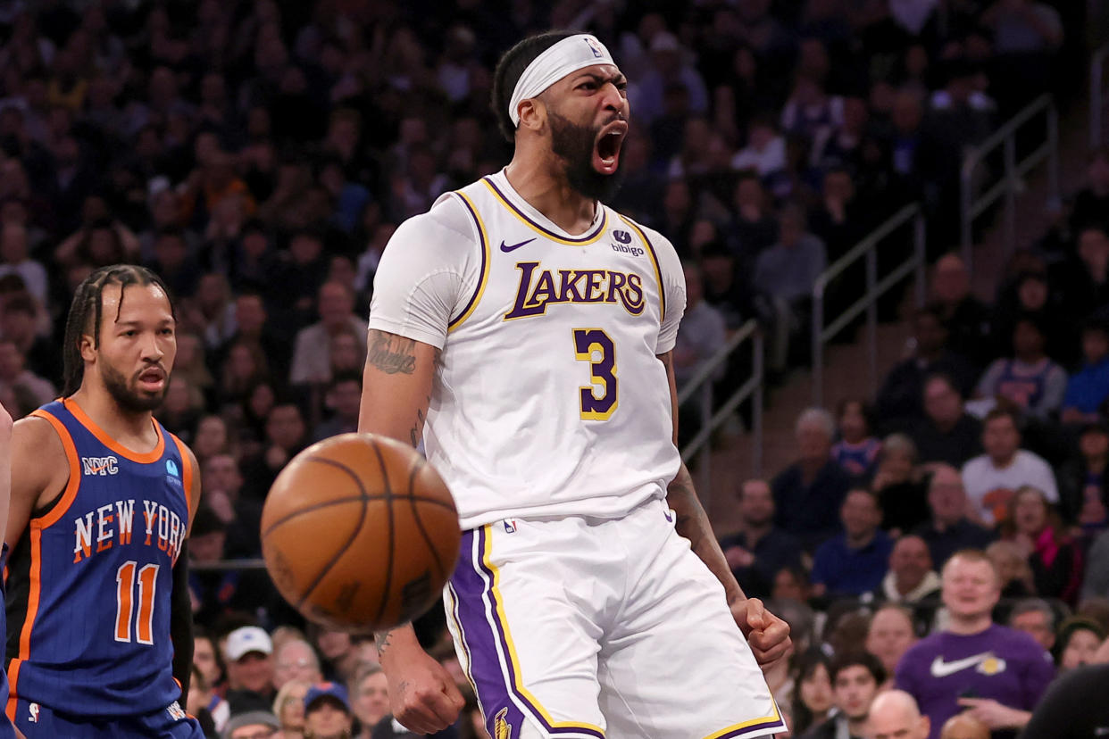 Feb 3, 2024; New York, New York, USA; Los Angeles Lakers forward Anthony Davis (3) reacts after a dunk against New York Knicks guard Jalen Brunson (11) during the first quarter at Madison Square Garden. Mandatory Credit: Brad Penner-USA TODAY Sports