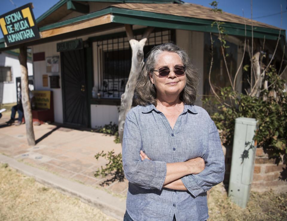 Leesa Jacobson stands outside the Arivaca Humanitarian Aid Office in Arivaca, Arizona.