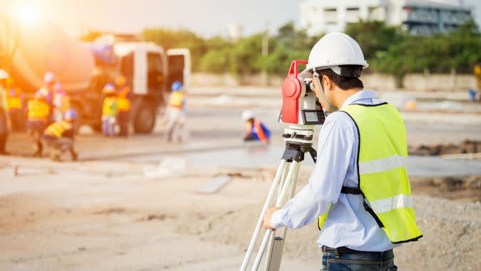 civil engineer surveying a construction site
