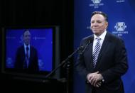 CAQ leader Francois Legault speaks to the media following the Leaders debate in Montreal, March 20, 2014. Quebec's governing Parti Quebecois, whose ultimate goal is to take the province out of the Canadian federation, is falling behind in the runup to the April 7 provincial election, a poll on Tuesday showed, with the federalist vote solidifying around the opposition Liberals. REUTERS/Christinne Muschi (CANADA - Tags: ELECTIONS POLITICS)