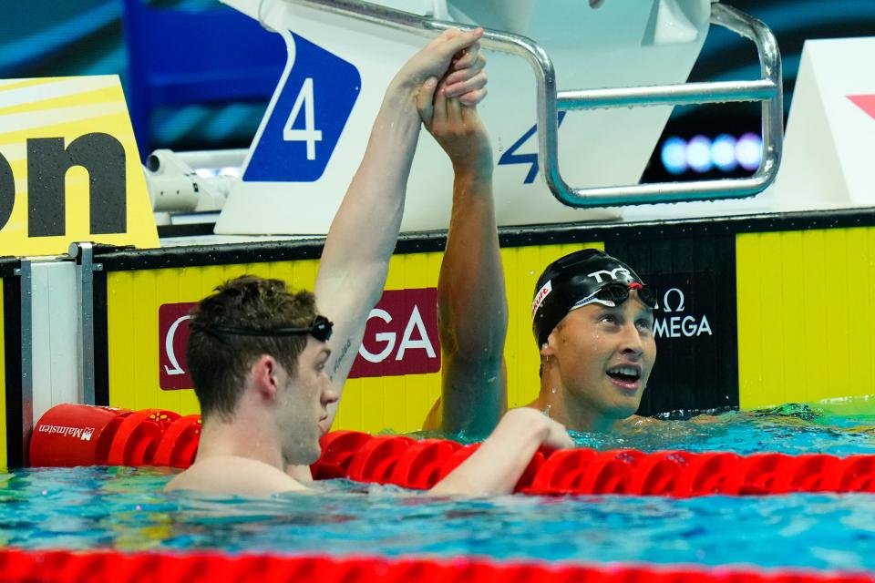 Hunter Armstrong, right, of the United States celebrates with Justin Ress of the United States after their men's 50-meter backstroke final at the 19th FINA World Championships in Budapest, Hungary, Saturday, June 25, 2022. Ress won the race, was disqualified and later had that reversed and received the gold medal. Armstrong ended up being the silver medalist.