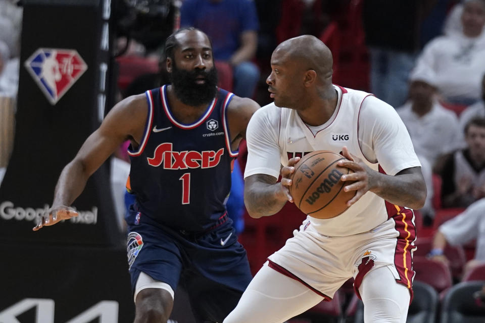 Miami Heat forward P.J. Tucker, right, looks for an opening past Philadelphia 76ers guard James Harden (1) during the first half of Game 5 of an NBA basketball second-round playoff series, Tuesday, May 10, 2022, in Miami. (AP Photo/Wilfredo Lee)