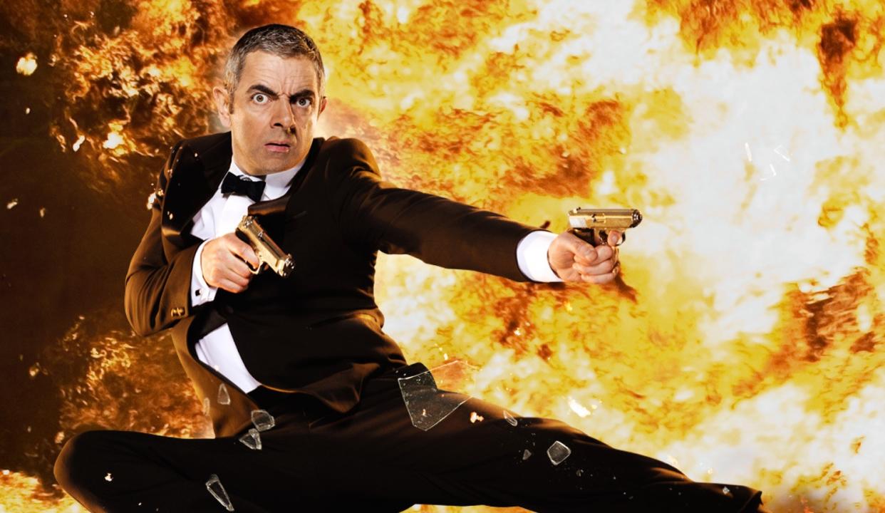 Rowan Atkinson exploding onto the screen in 2011's 'Johnny English Reborn' (credit: Universal)