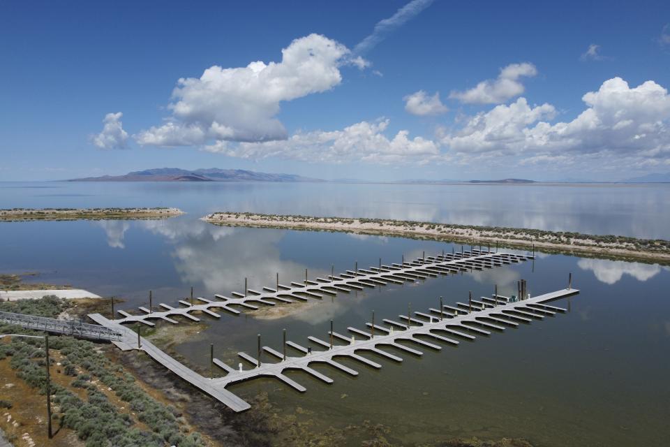 Historic snowpack this winter increased the Great Salt Lake's elevation beyond last year's record lows set and refilled the docks at the Antelope Island State Park Marina on June 15, 2023, near Syracuse, Utah. After years of sailboats being hoisted out of the shrinking Great Salt Lake amid fears they might not return, sailors are back this summer. (AP Photo/Rick Bowmer)