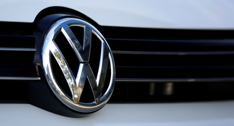 The logo of German car maker Volkswagen is seen on a car outside a garage in Vienna