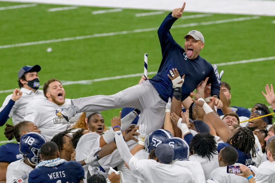 Georgia Southern coach Chad Lunsford and players celebrate the team's 38-3 victory over Louisiana Tech in the New Orleans Bowl game on Dec. 23, 2020.