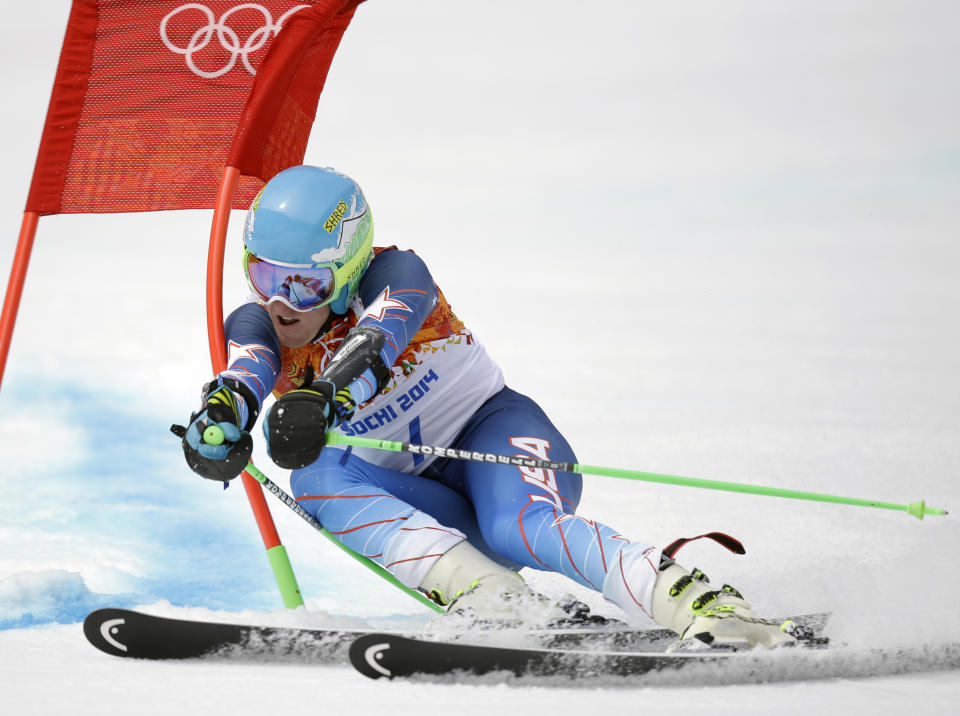 United States' Ted Ligety passes a gate in the first run of the men's giant slalom at the Sochi 2014 Winter Olympics, Wednesday, Feb. 19, 2014, in Krasnaya Polyana, Russia. (AP Photo/Luca Bruno)